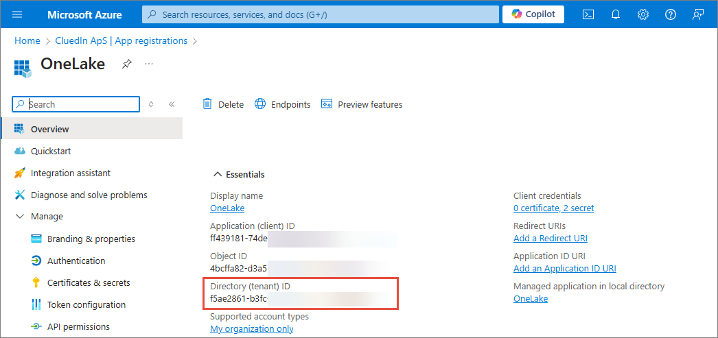 Azure app registration Overview page for OneLake with the Directory (tenant) ID highlighted under Essentials